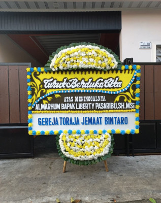 Papan Bunga Duka di Okaba